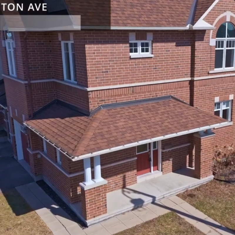 Group of property management professionals in a meeting, discussing strategies and client services in an office setting.
