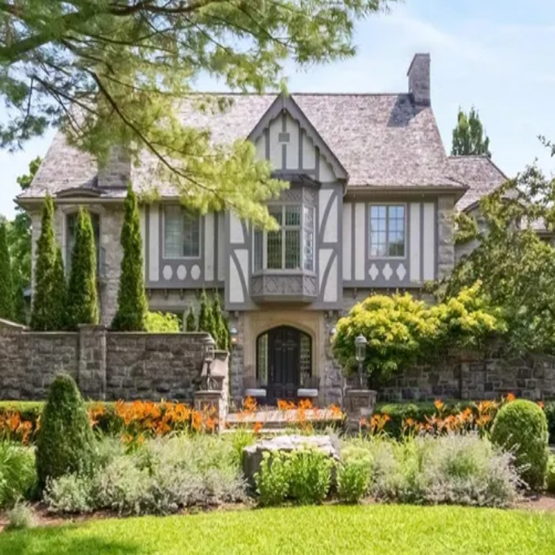 480 Manor Avenue, Ottawa — charming brick bungalow with front porch and well-maintained lawn in a quiet residential area.