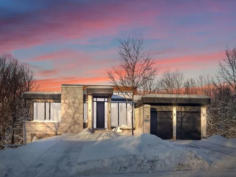 Modern Apartment Building Exterior in Ottawa Contemporary multi-storey apartment building with balconies and large windows, located in Ottawa’s urban neighborhood.